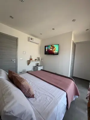 Letto o letti in una camera di Rooms La Playa