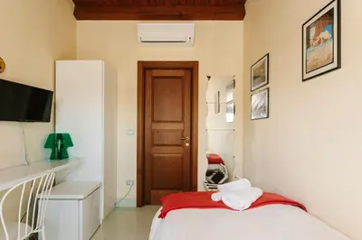 Letto o letti in una camera di Dimora Archimedea