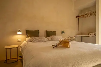 Letto o letti in una camera di Tenuta le Menadi