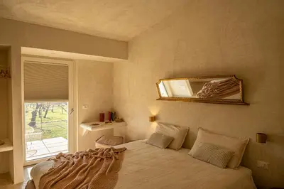 Letto o letti in una camera di Tenuta le Menadi