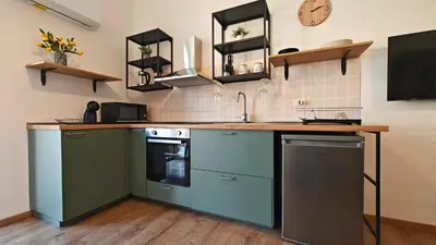 Cucina o angolo cottura di Marconi Hub Siracusa, appartamento moderno vicino ad Ortigia con Wifi e AC