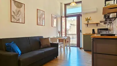 Area soggiorno di Marconi Hub Siracusa, appartamento moderno vicino ad Ortigia con Wifi e AC