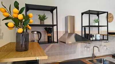 Cucina o angolo cottura di Marconi Hub Siracusa, appartamento moderno vicino ad Ortigia con Wifi e AC