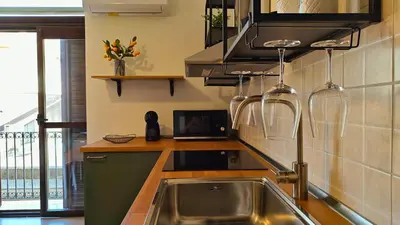 Cucina o angolo cottura di Marconi Hub Siracusa, appartamento moderno vicino ad Ortigia con Wifi e AC