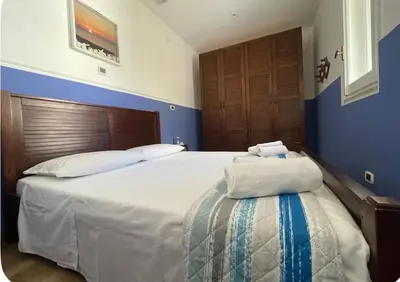 Letto o letti in una camera di Villetta Fronte Mare con Giardino Privato