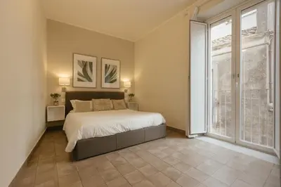 Letto o letti in una camera di Stay in Catania