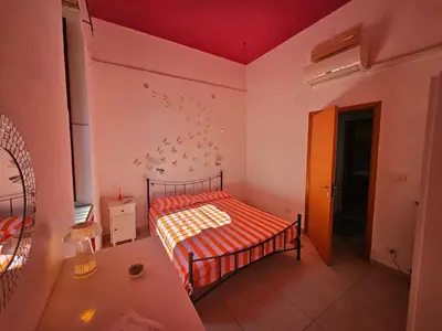Letto o letti in una camera di A week in Sicily - charming apartment