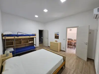 Letto o letti in una camera di Cavour Apartaments