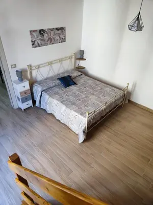 Letto o letti in una camera di Cavour Apartaments