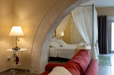 Letto o letti in una camera di Ortigia Stone's Loft Spa