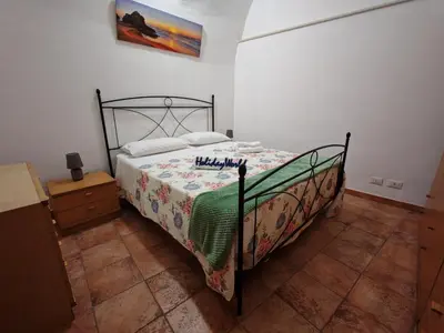 Letto o letti in una camera di Casa Carmela 53 by Holiday World