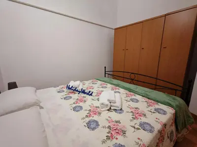 Letto o letti in una camera di Casa Carmela 53 by Holiday World