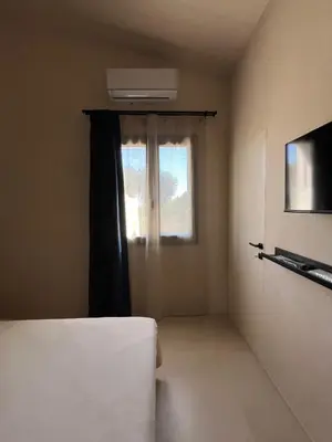 Letto o letti in una camera di B&B Monstera SicilianExperience