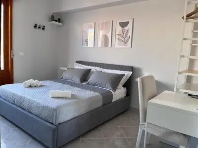 Letto o letti in una camera di Colombo Rooms