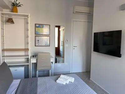 Letto o letti in una camera di Colombo Rooms