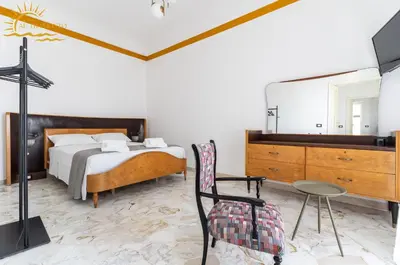 Letto o letti in una camera di Casa al tramonto