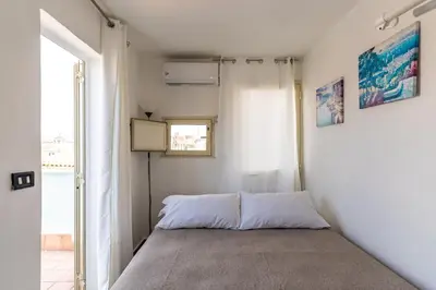 Letto o letti in una camera di La terrazza di Apollo by Wonderful Italy