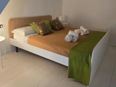 Letto o letti in una camera di The Cordari House