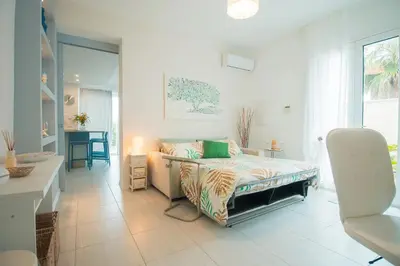 Letto o letti in una camera di Villamaresicilia appartamento e stanze nel lungomare