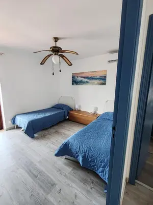 Letto o letti in una camera di AMY'S VILLA sul mare Costa Saracena Castelluccio
