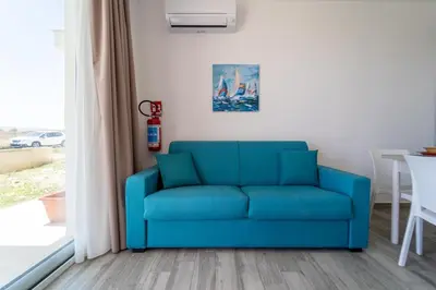 Area soggiorno di GuestHost - Borgo 84 Marzamemi - Hermes Apartment