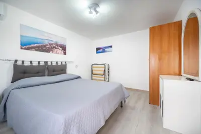 Letto o letti in una camera di Casa Sauro 10