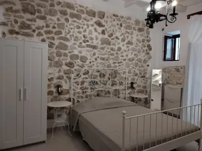 Letto o letti in una camera di Casa dell'olivo