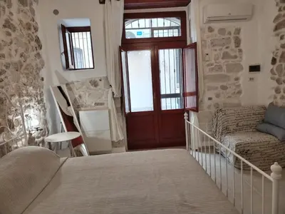Letto o letti in una camera di Casa dell'olivo