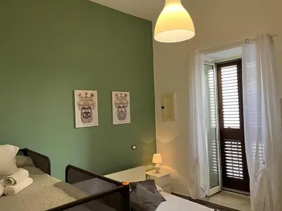 Letto o letti in una camera di House Victoria casa vacanze per 8 persone a Noto