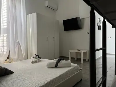 Letto o letti in una camera di House Victoria casa vacanze per 8 persone a Noto