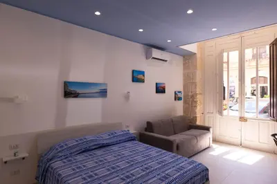 Letto o letti in una camera di Moni House Ortigia