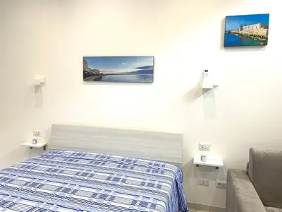 Letto o letti in una camera di Moni House Ortigia