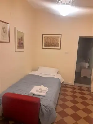 Letto o letti in una camera di Casa Sveva, una finestra sulla storia