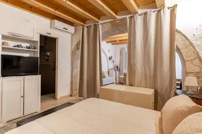 Letto o letti in una camera di Alice's Studio by Wonderful Italy