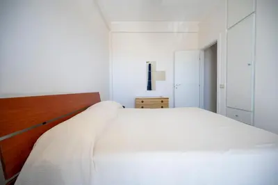 Letto o letti in una camera di Villa Reitani San Lorenzo - SiciliaVacanza