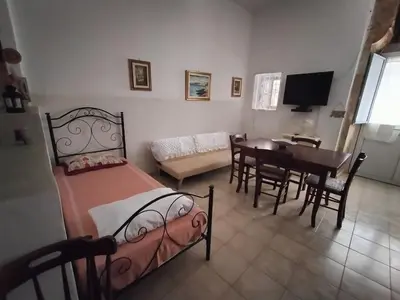 Letto o letti in una camera di Casa Nicolù
