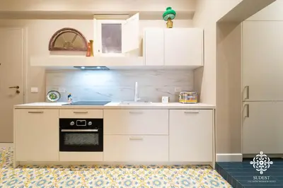 Cucina o angolo cottura di Gli Archi di Aretusa - Design Apartment in the heart of Ortigia