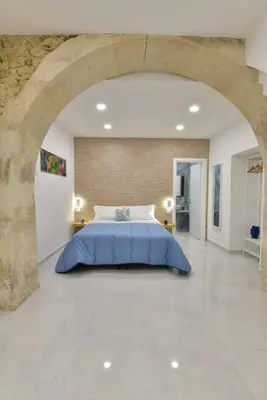 Letto o letti in una camera di Appartamento Ortigia Vicolo Lettighieri 28
