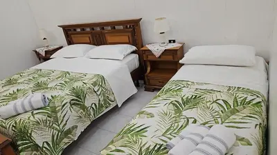 Letto o letti in una camera di Casa Noemi