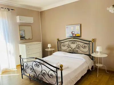 Letto o letti in una camera di Villa Carmen con piscina