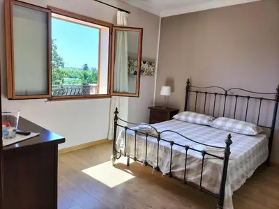 Letto o letti in una camera di Villa Carmen con piscina