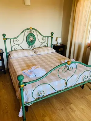 Letto o letti in una camera di Villa Carmen con piscina