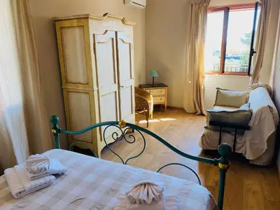 Letto o letti in una camera di Villa Carmen con piscina