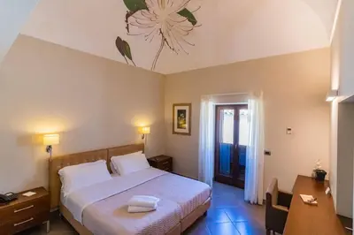 Letto o letti in una camera di Le Magnolie Hotel