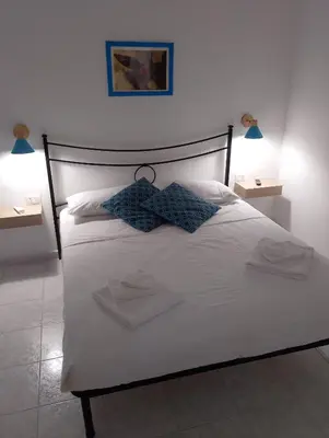 Letto o letti in una camera di Casa MALFITANO Siria