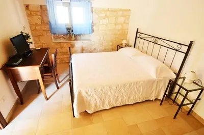 Letto o letti in una camera di Alla Corte di Nonna Maria