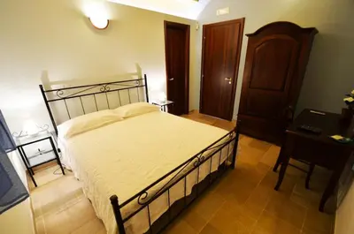 Letto o letti in una camera di Alla Corte di Nonna Maria