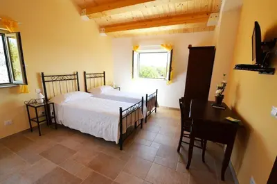 Letto o letti in una camera di Alla Corte di Nonna Maria