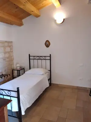 Letto o letti in una camera di Alla Corte di Nonna Maria