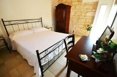 Letto o letti in una camera di Alla Corte di Nonna Maria